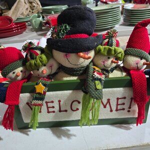 Sitting on edge w/ Santa telling Twas the night before christmas story